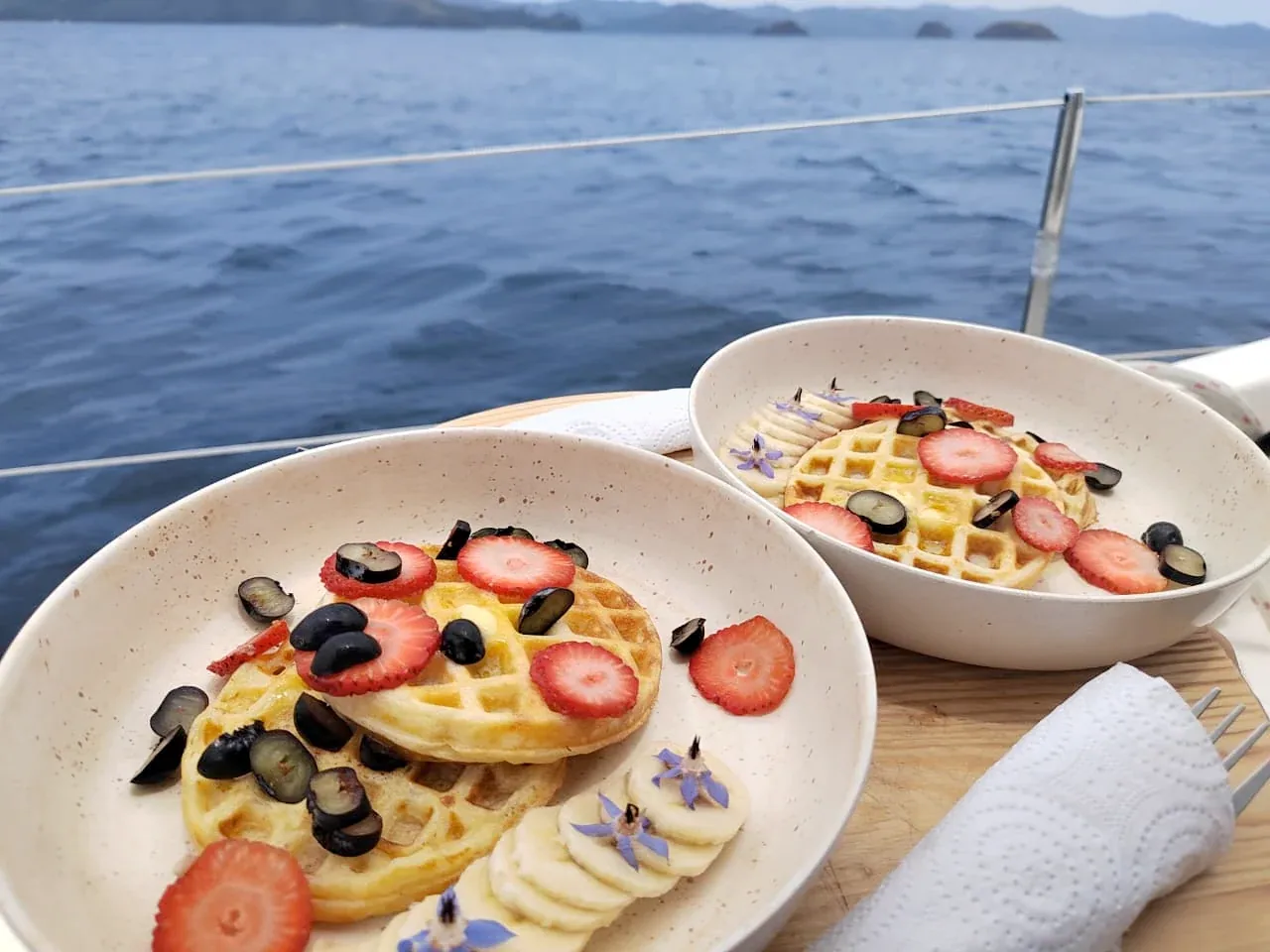 Anna Holala onboard waffles and fresh fruit