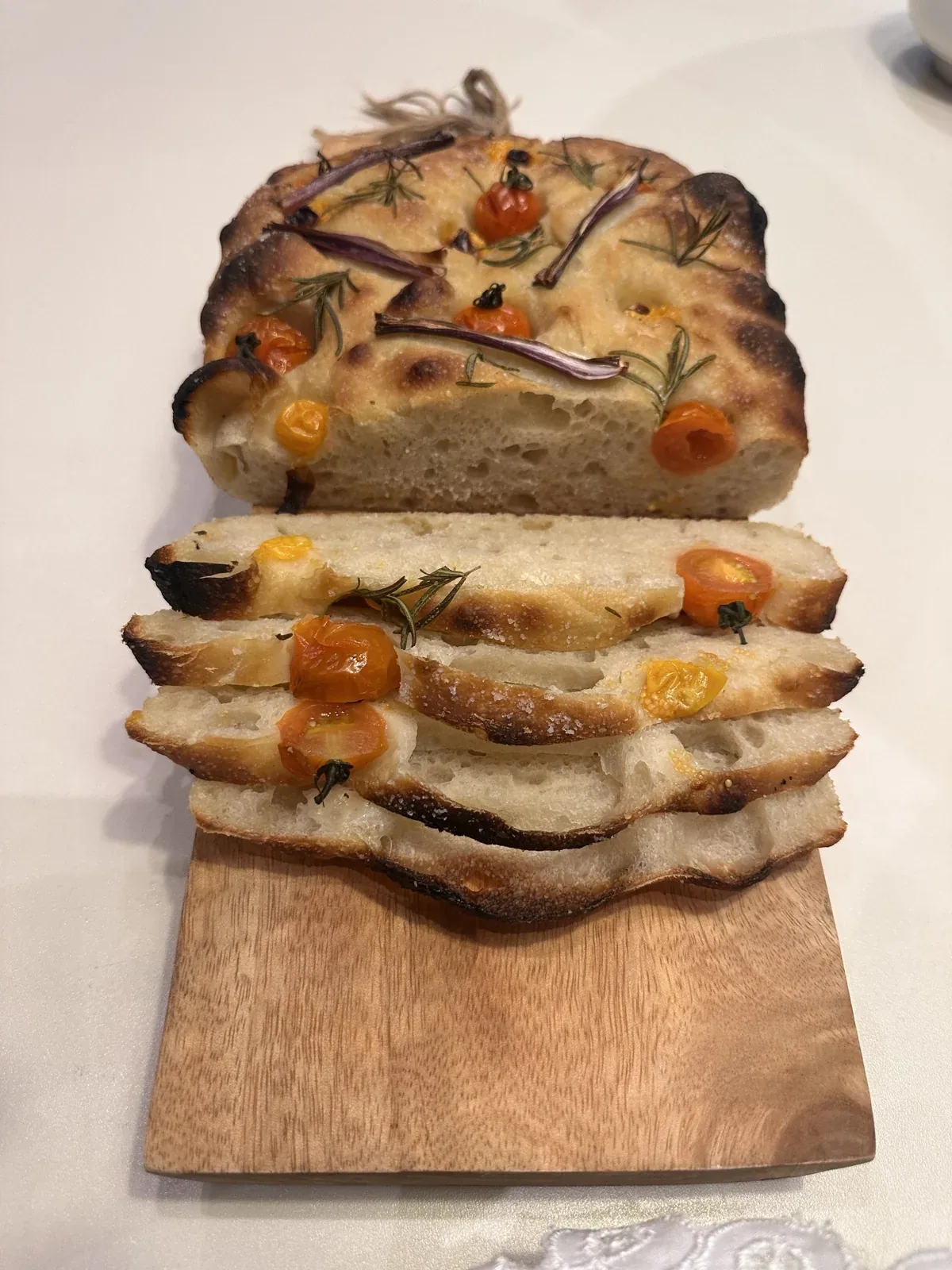 Freshly baked focaccia sliced for serving
